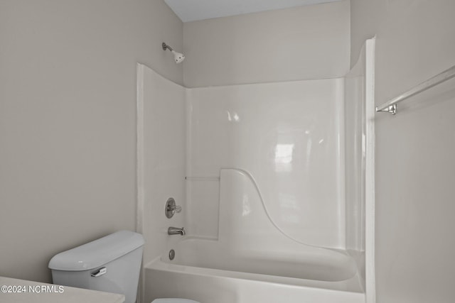 bathroom featuring toilet and bathtub / shower combination