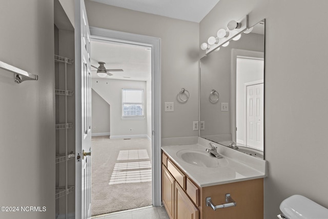 bathroom with tile patterned floors, vanity, toilet, and ceiling fan