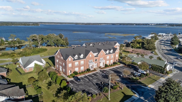 birds eye view of property with a water view