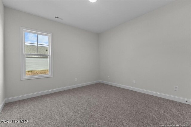 unfurnished room with carpet floors