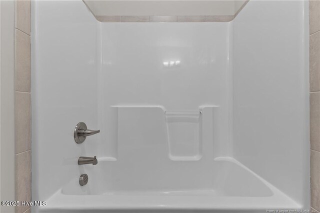 bathroom with shower / bath combination