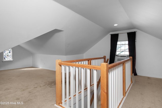 additional living space featuring lofted ceiling, carpet, and baseboards