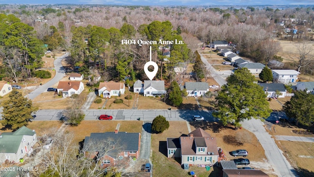 aerial view featuring a residential view and a view of trees