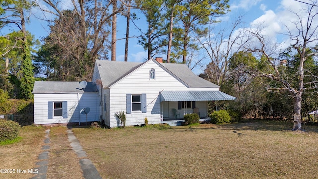 view of front of house featuring a front yard and a chimney