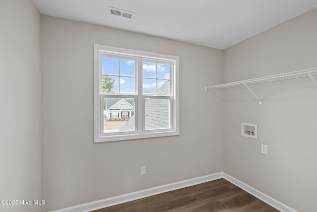 laundry area featuring laundry area, washer hookup, visible vents, baseboards, and dark wood-style floors