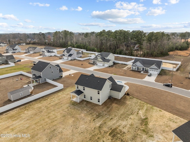 aerial view with a residential view and a wooded view