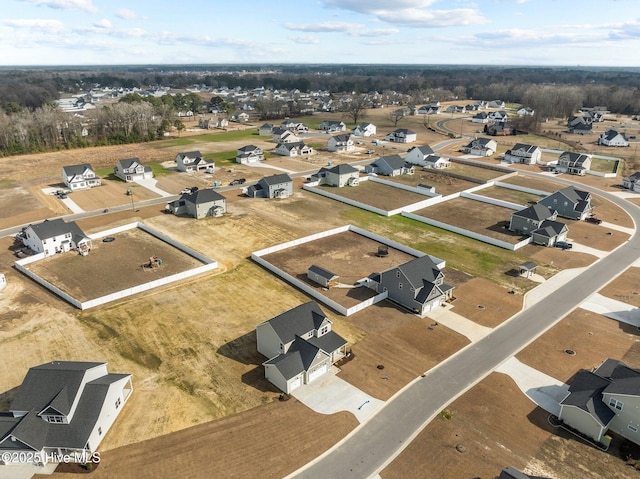 birds eye view of property with a residential view