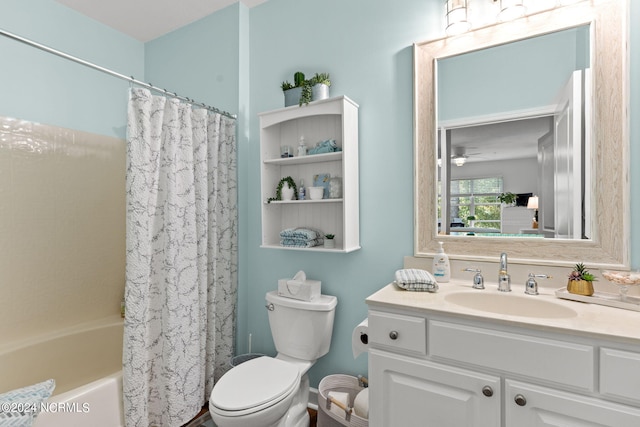 full bathroom with ceiling fan, shower / bath combo, vanity, and toilet