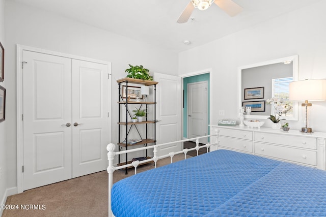 carpeted bedroom with a closet and ceiling fan