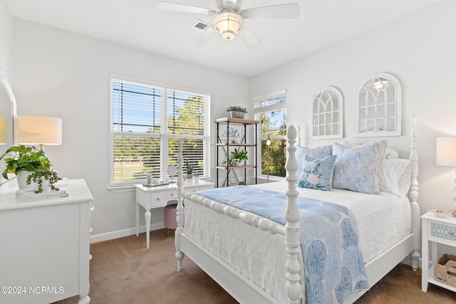 bedroom featuring ceiling fan and carpet