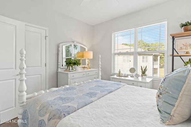 bedroom with multiple windows and ceiling fan