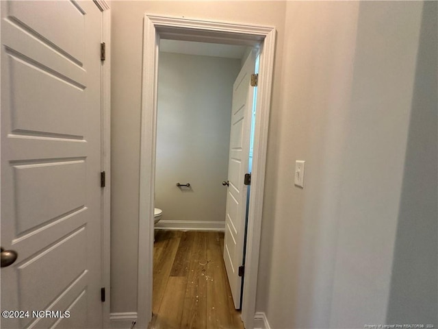 corridor featuring dark wood-type flooring