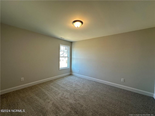 unfurnished room with carpet floors