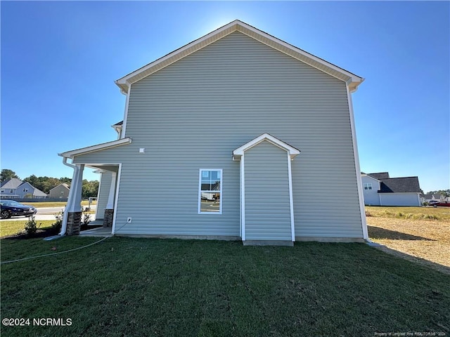 view of property exterior featuring a yard