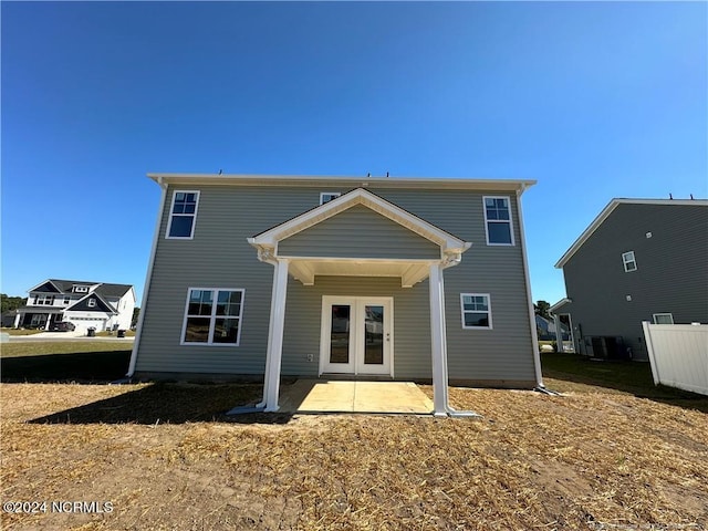 rear view of property with a patio and french doors