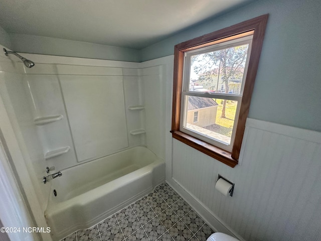 bathroom with shower / bath combination and tile patterned floors