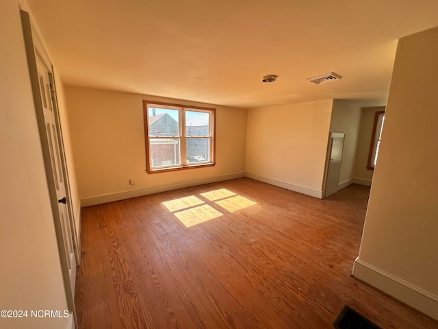 unfurnished room with light hardwood / wood-style flooring