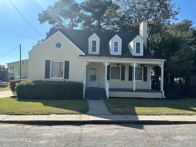 view of front of house featuring a front lawn and covered porch