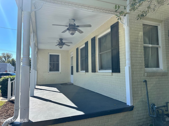 view of side of home featuring ceiling fan and a patio