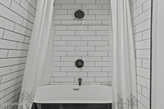 412 Womble St, Oak Island, NC 28465 - bathroom featuring shower / tub combo