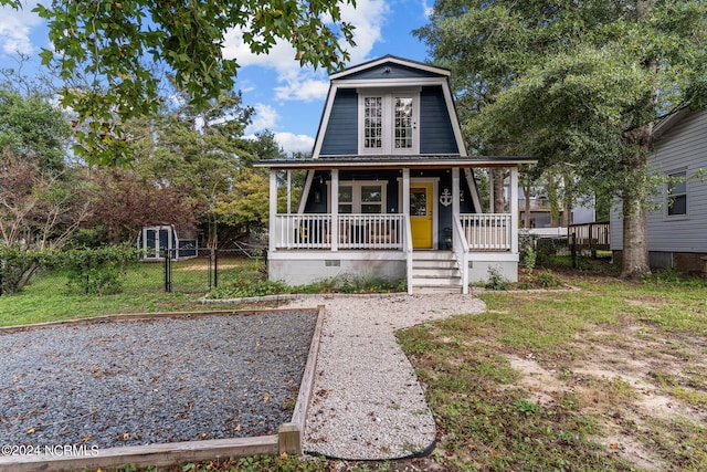 a-frame home featuring a gate, a porch, crawl space, and fence