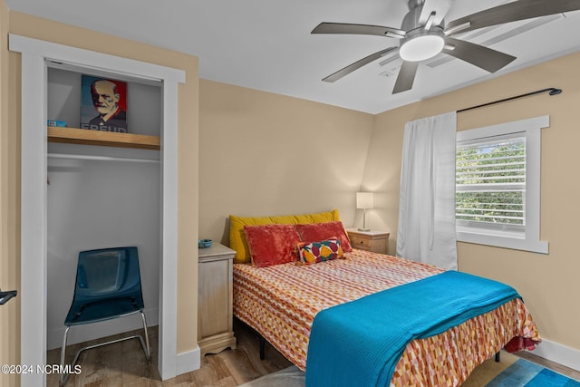 bedroom with hardwood / wood-style flooring and ceiling fan