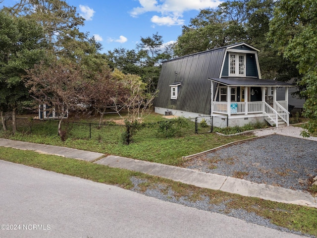 view of front of house with a front lawn and a porch