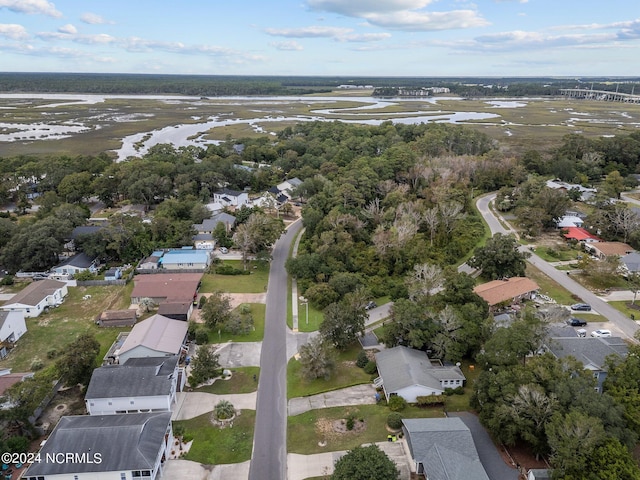 412 Womble St, Oak Island, NC 28465 - aerial overview of property's location featuring a large body of water and nearby suburban area