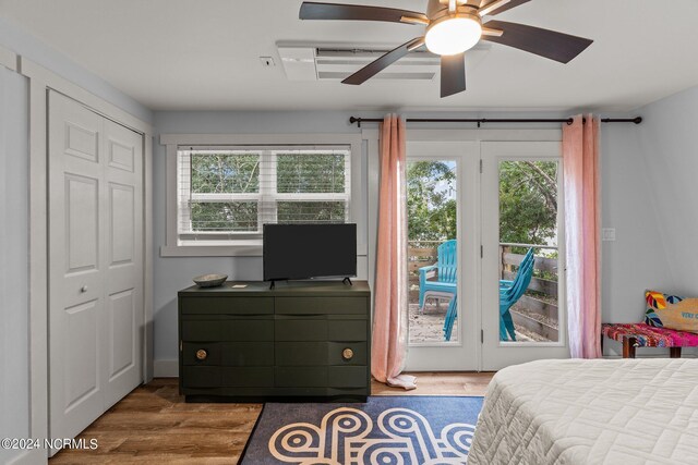 412 Womble St, Oak Island, NC 28465 - bedroom featuring access to exterior, wood finished floors, and ceiling fan