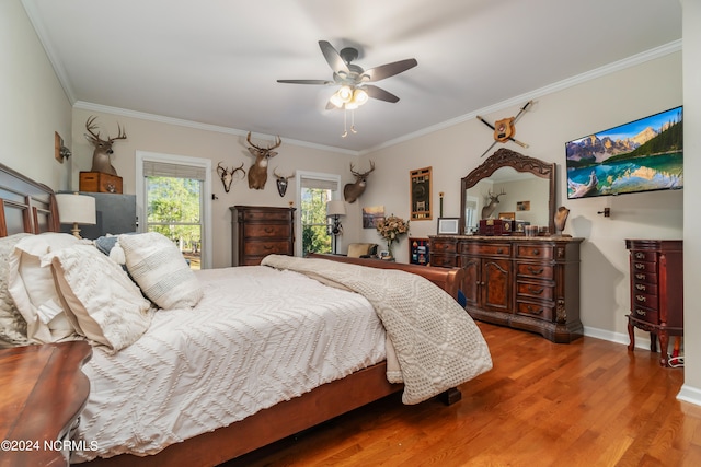 bedroom featuring crown molding, ceiling fan, and wood-type flooring