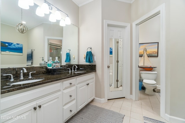 bathroom featuring crown molding, tile patterned floors, vanity, and toilet