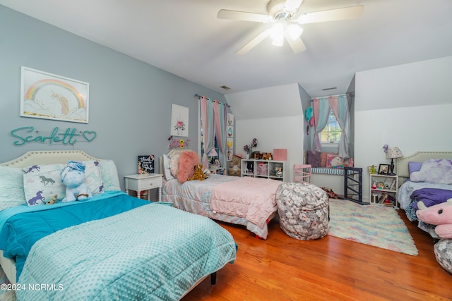 bedroom with lofted ceiling, wood-type flooring, and ceiling fan