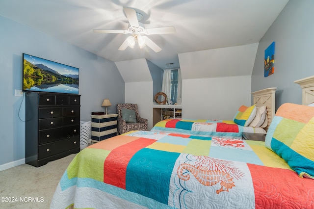 bedroom with ceiling fan, light carpet, and vaulted ceiling