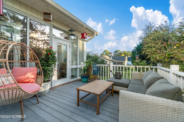 wooden terrace featuring an outdoor living space