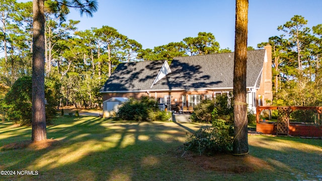 back of house featuring a yard