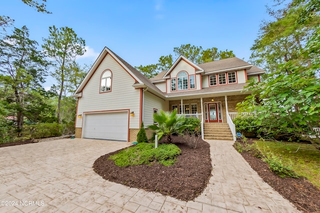 view of front property featuring a garage and covered porch