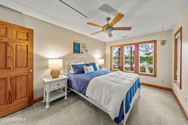 carpeted bedroom with ceiling fan