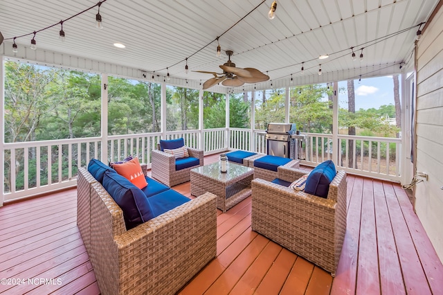 wooden deck with an outdoor living space, area for grilling, and ceiling fan