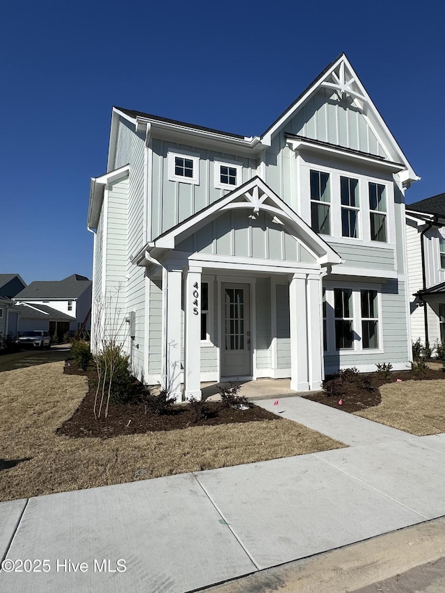 view of front of house with board and batten siding and covered porch