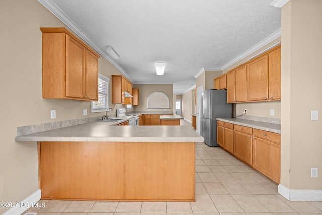 kitchen with stainless steel refrigerator, crown molding, kitchen peninsula, and light tile patterned flooring