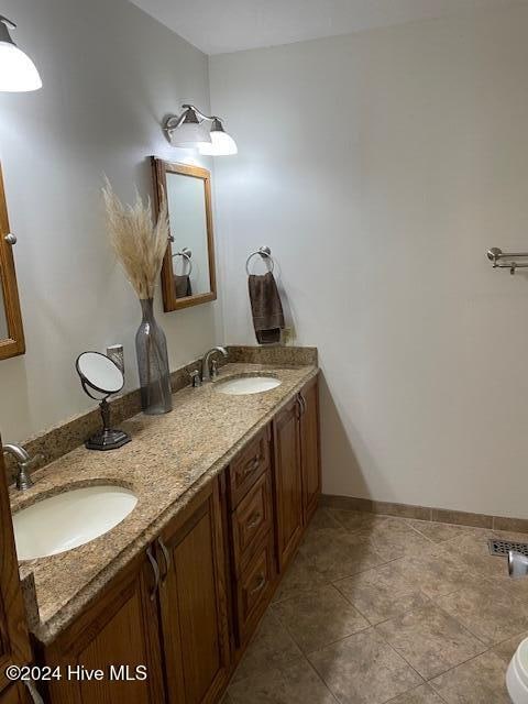 bathroom featuring tile patterned floors and vanity