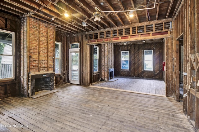 interior space with wood-type flooring and a fireplace
