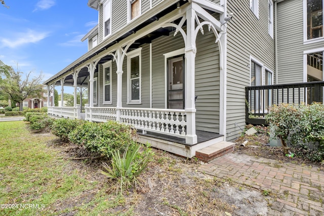 view of property exterior featuring covered porch