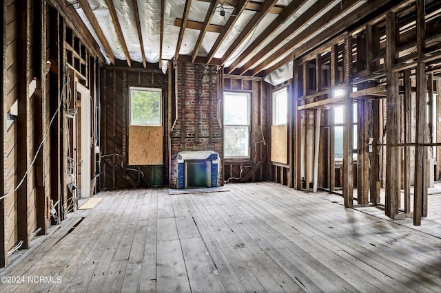 miscellaneous room with hardwood / wood-style flooring and a fireplace
