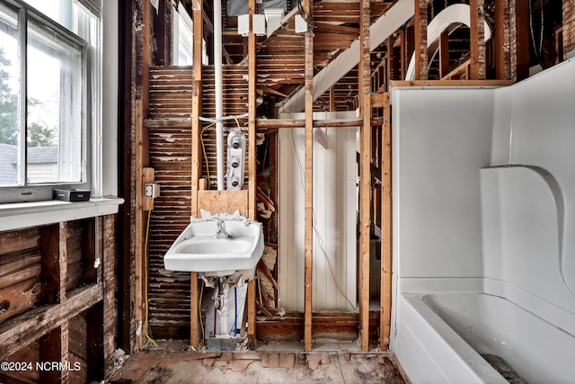 bathroom with a washtub