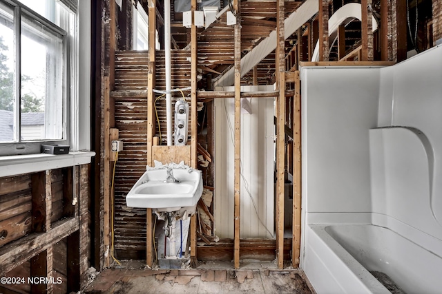 full bath with a tub to relax in
