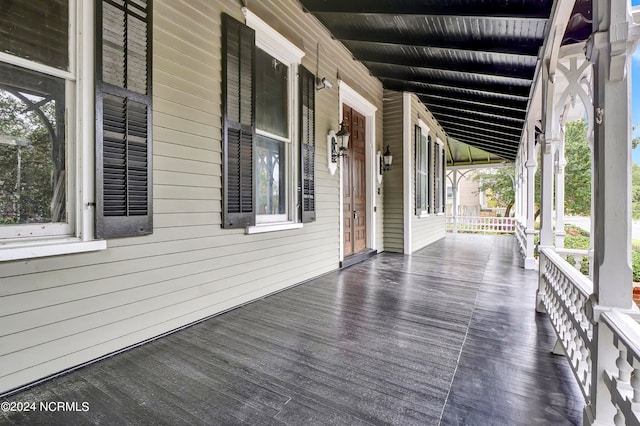 wooden terrace featuring a porch