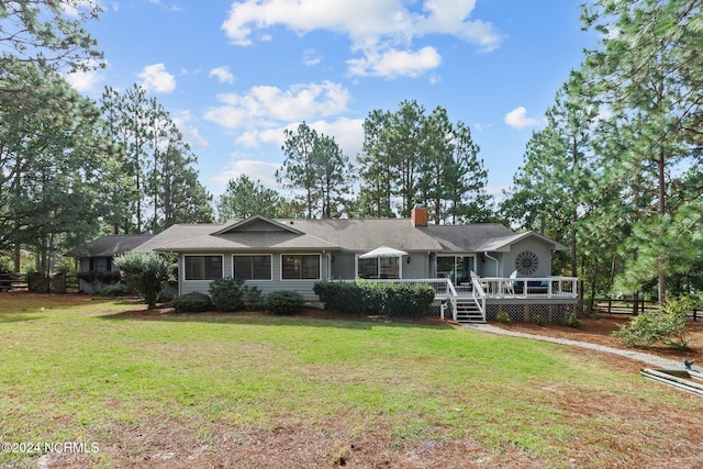 ranch-style home featuring a front yard