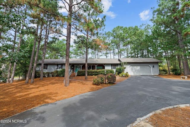 ranch-style house featuring a garage