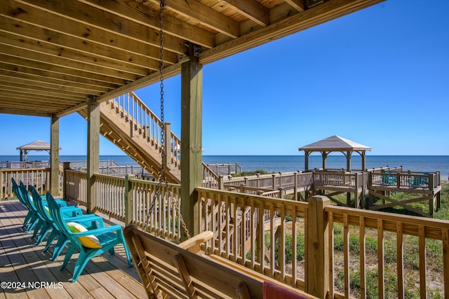 deck featuring a water view and a gazebo